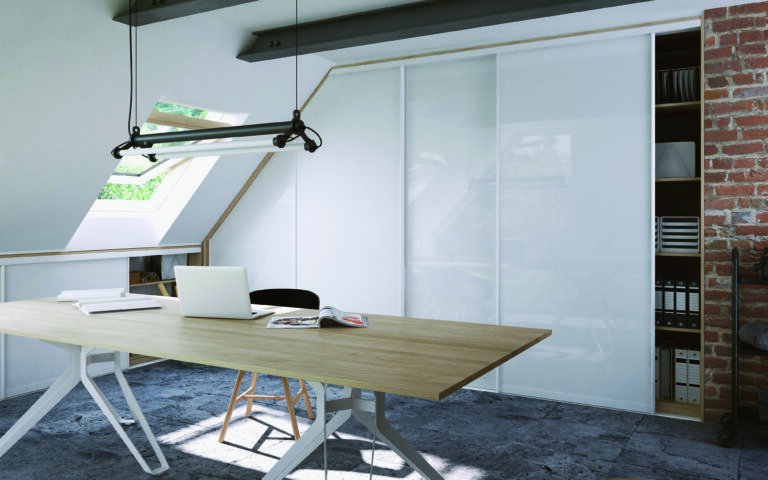 Bespoke fitted wardrobe in an alcove with sloped ceiling, designed by Komandor Scotland to maximize storage in alcoves and awkward corners.