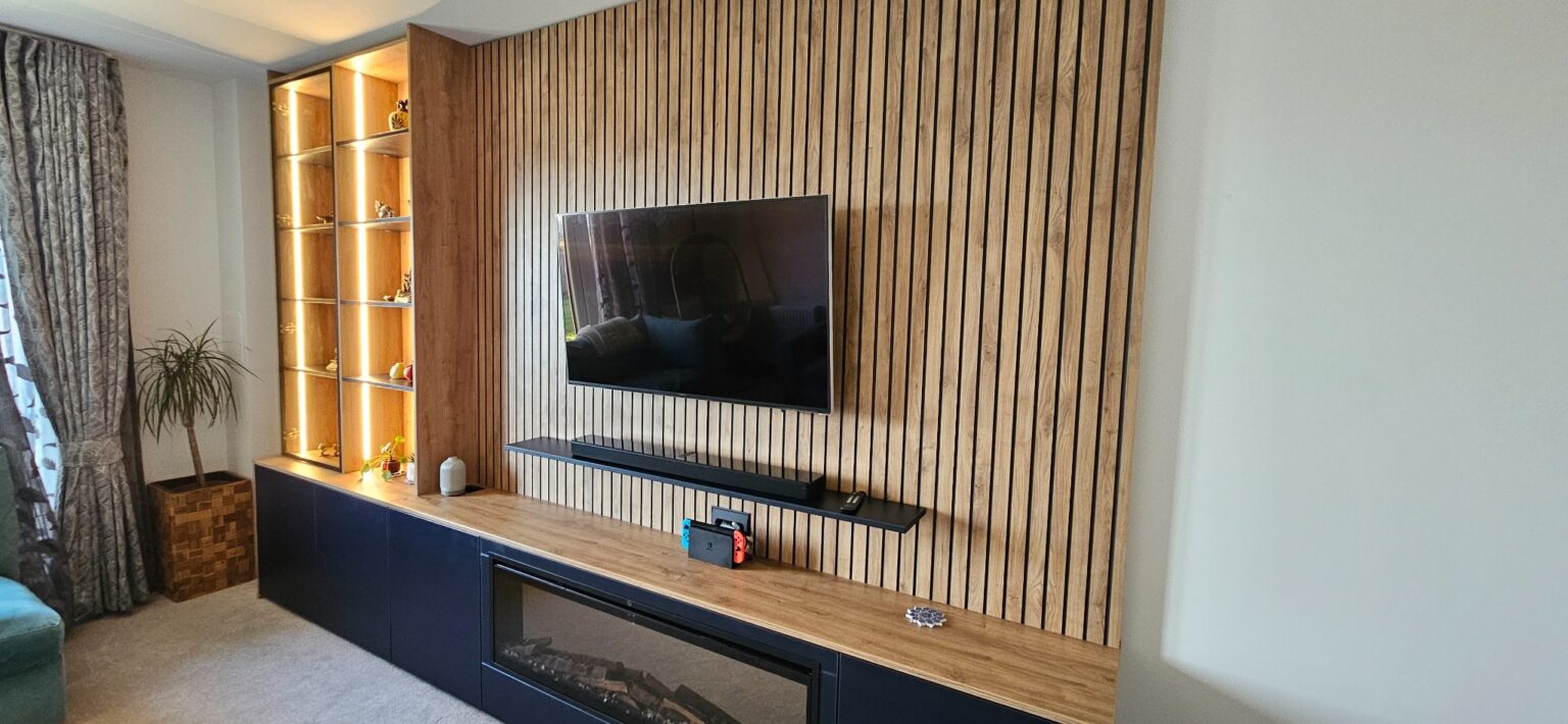 Bespoke Media Unit in Grandhome, Aberdeen 9 Wood effect slat wall panelling framing the television in a bespoke media unit
